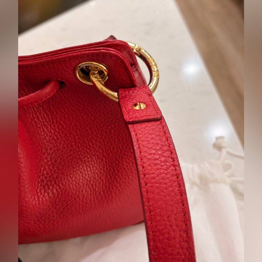 MCM Red Leather Bucket Bag
Crossbody Drawstring Gold Hardware - Picture 6 of 17